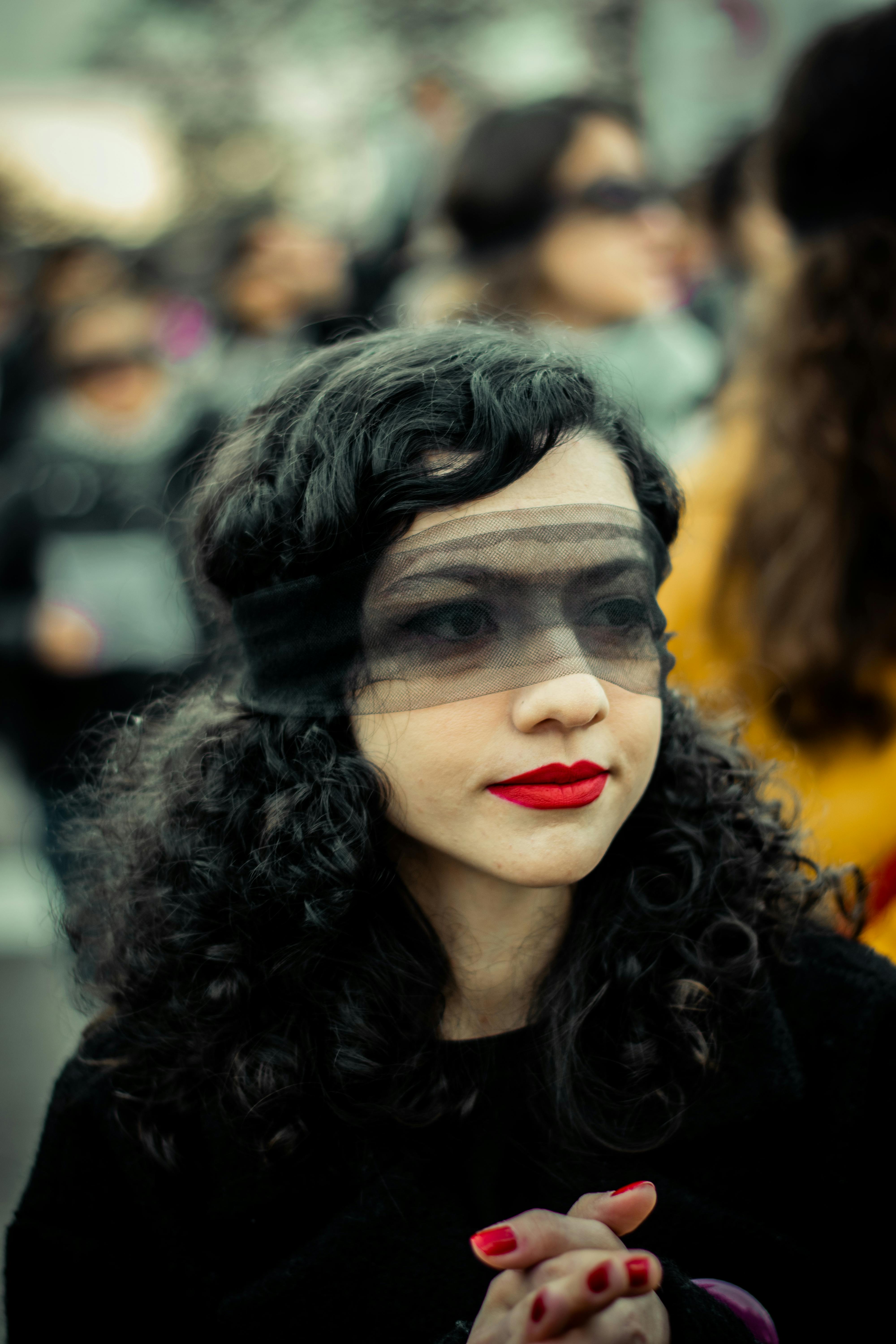 brunette woman with transparent blindfold on head