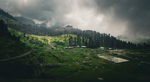 Free Dramatic view of lush green Malam Jabba landscape with hills and forest under overcast skies. Stock Photo