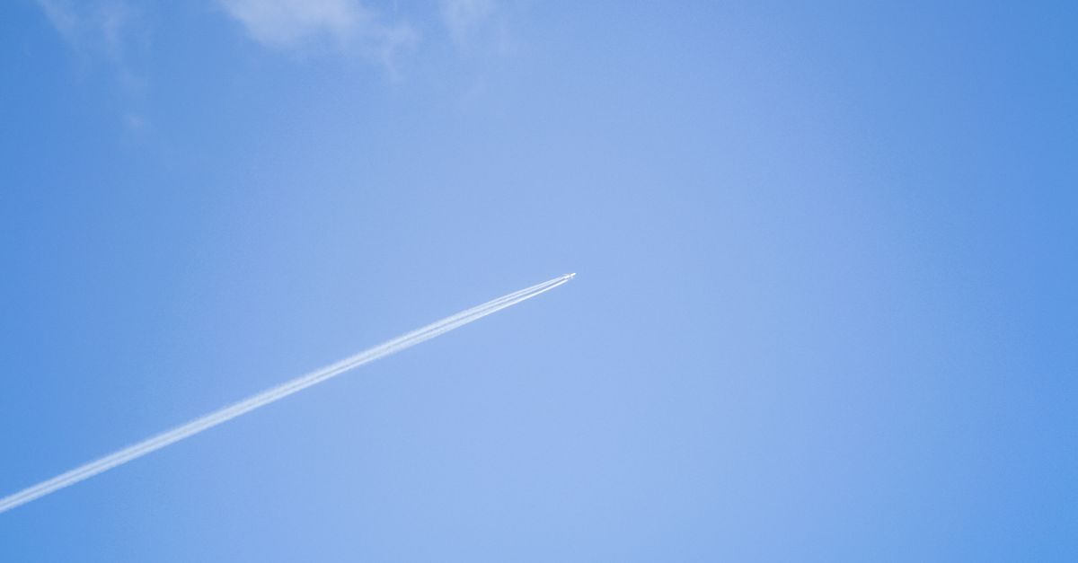 Airplane Forming Contrail in Sky · Free Stock Photo