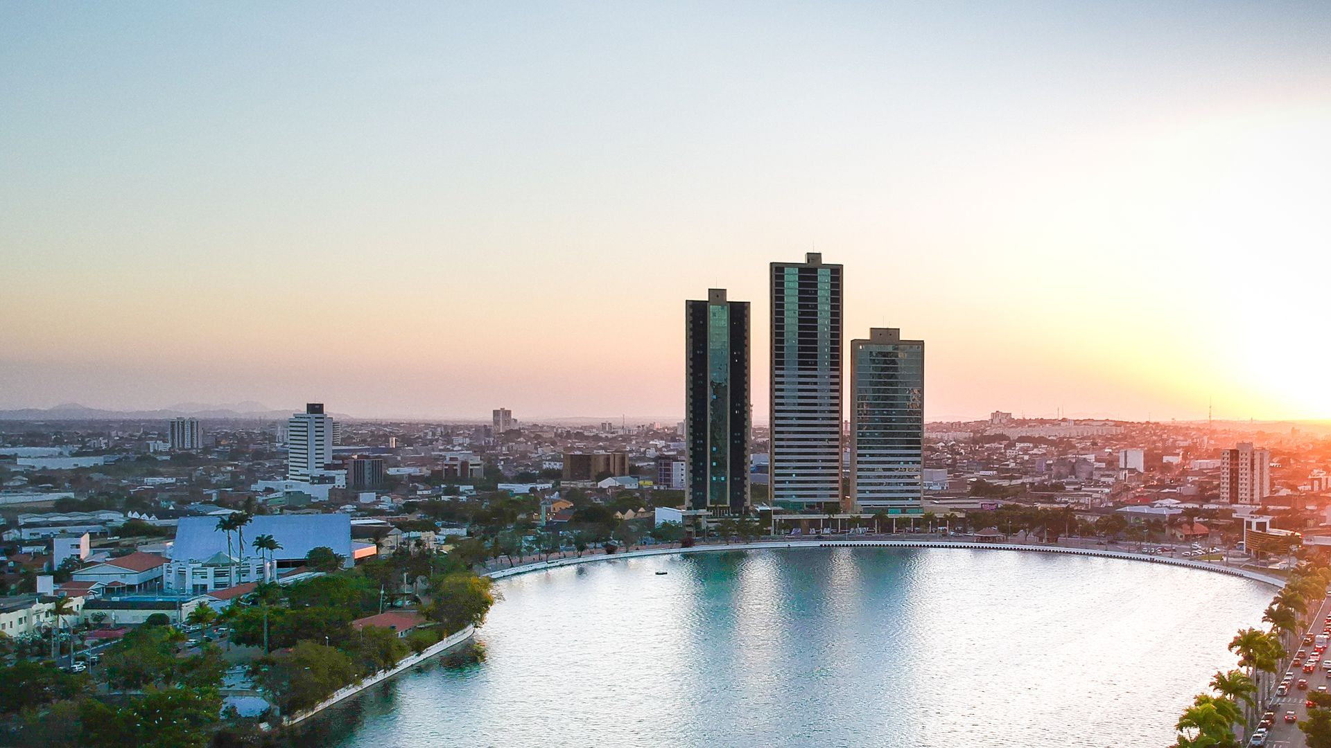 Stunning aerial cityscape of Campina Grande, Brazil, featuring high-rise buildings at sunset.