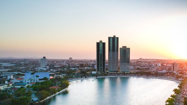 Stunning aerial cityscape of Campina Grande, Brazil, featuring high-rise buildings at sunset.