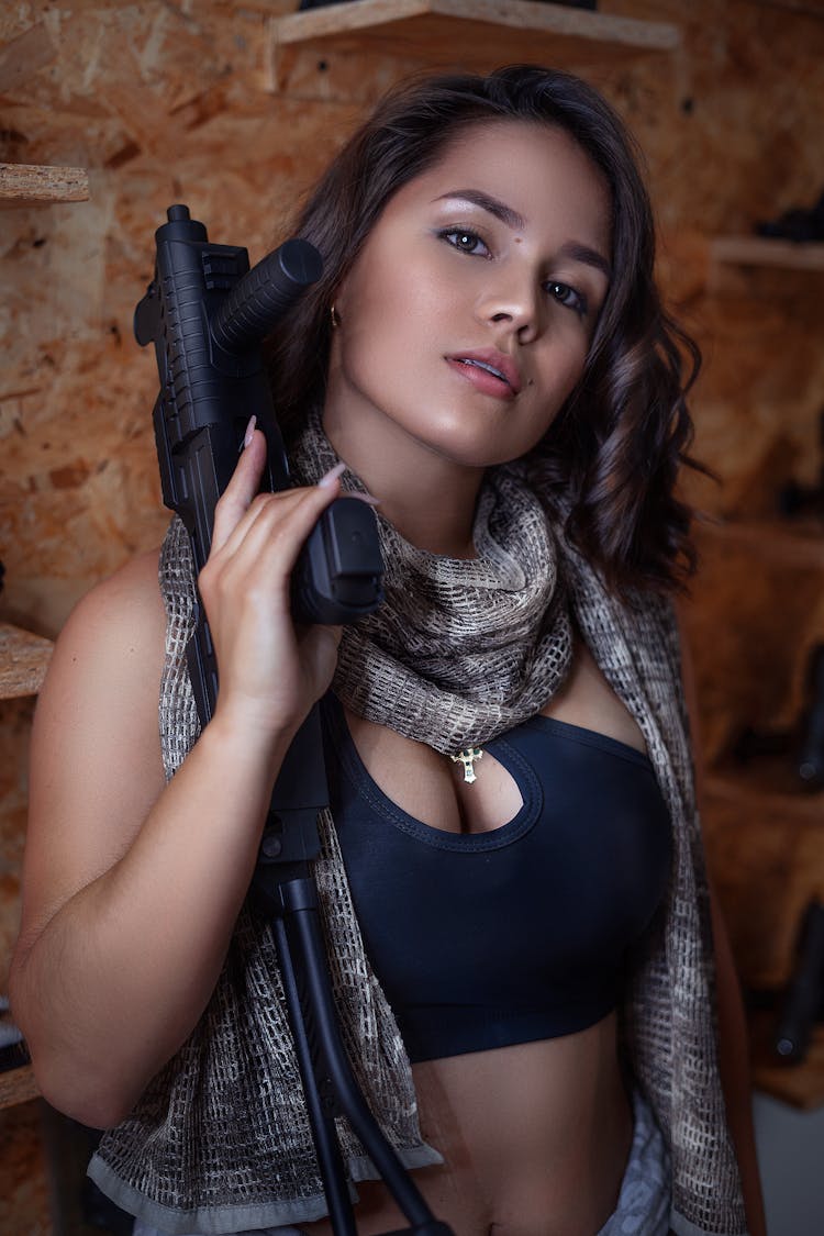 Portrait Of Woman Holding A Gun 