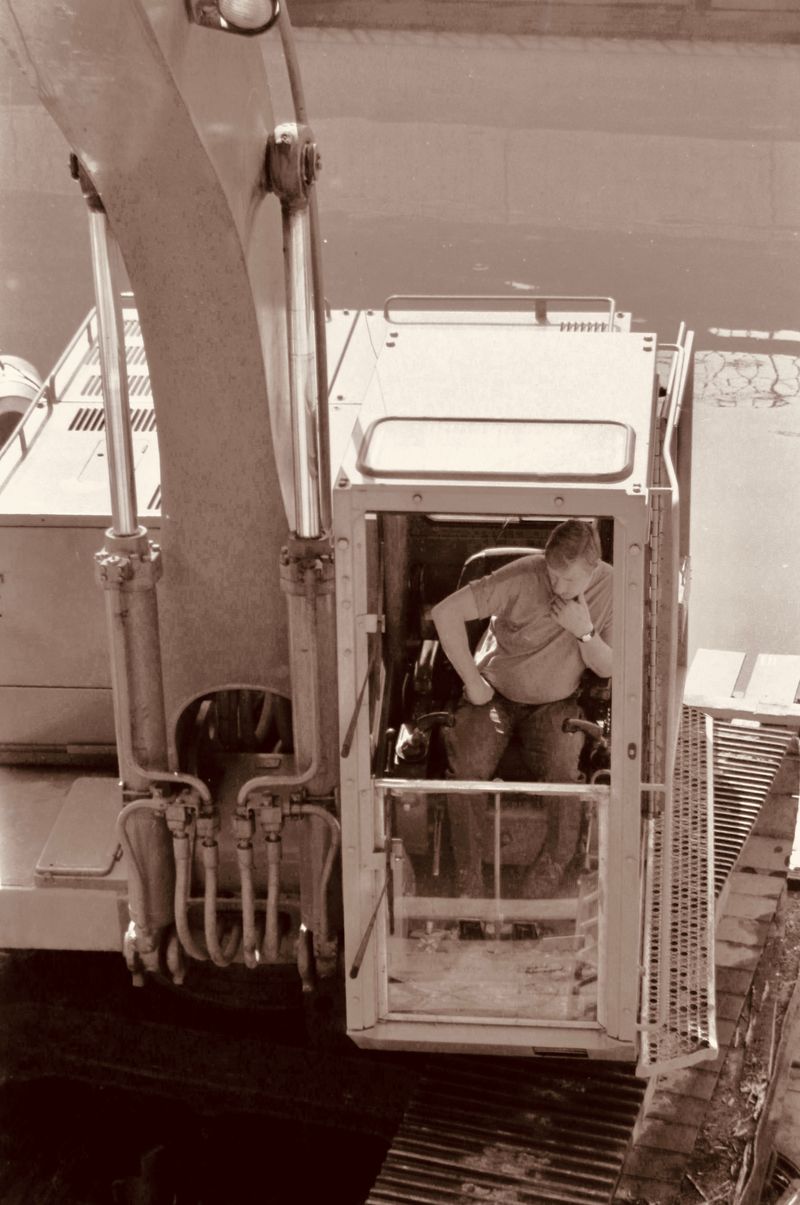 Construction worker operating heavy machinery