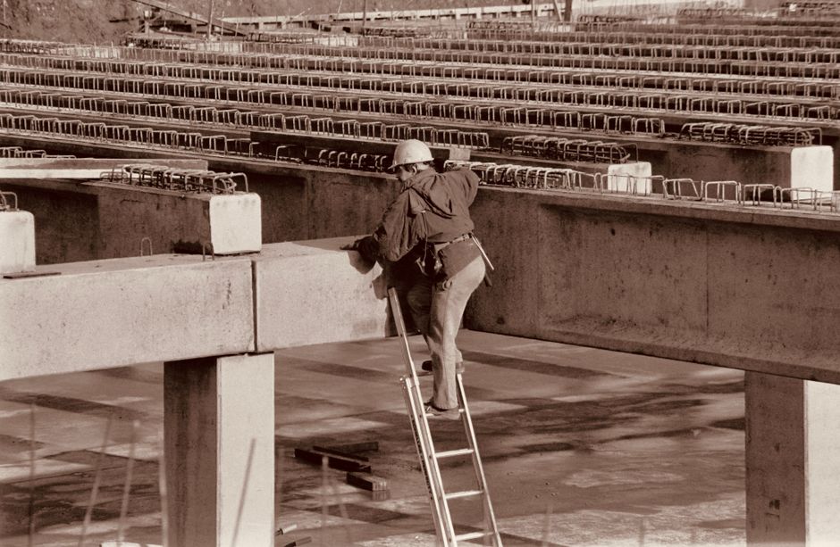 Construction Worker on Ladder - workers compensation construction