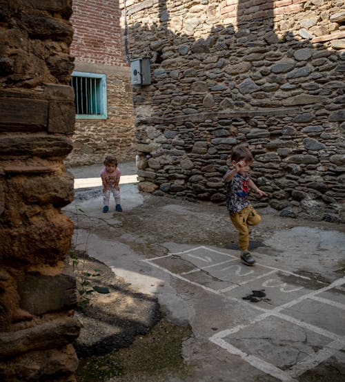 Children Playing in a Narrow Street 