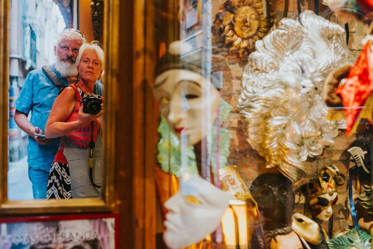 Elderly Couple Looking At Masks In Museum