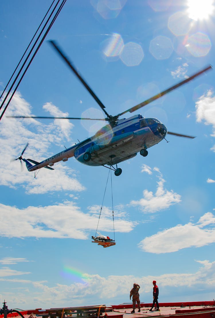 Helicopter With Cargo On Ropes