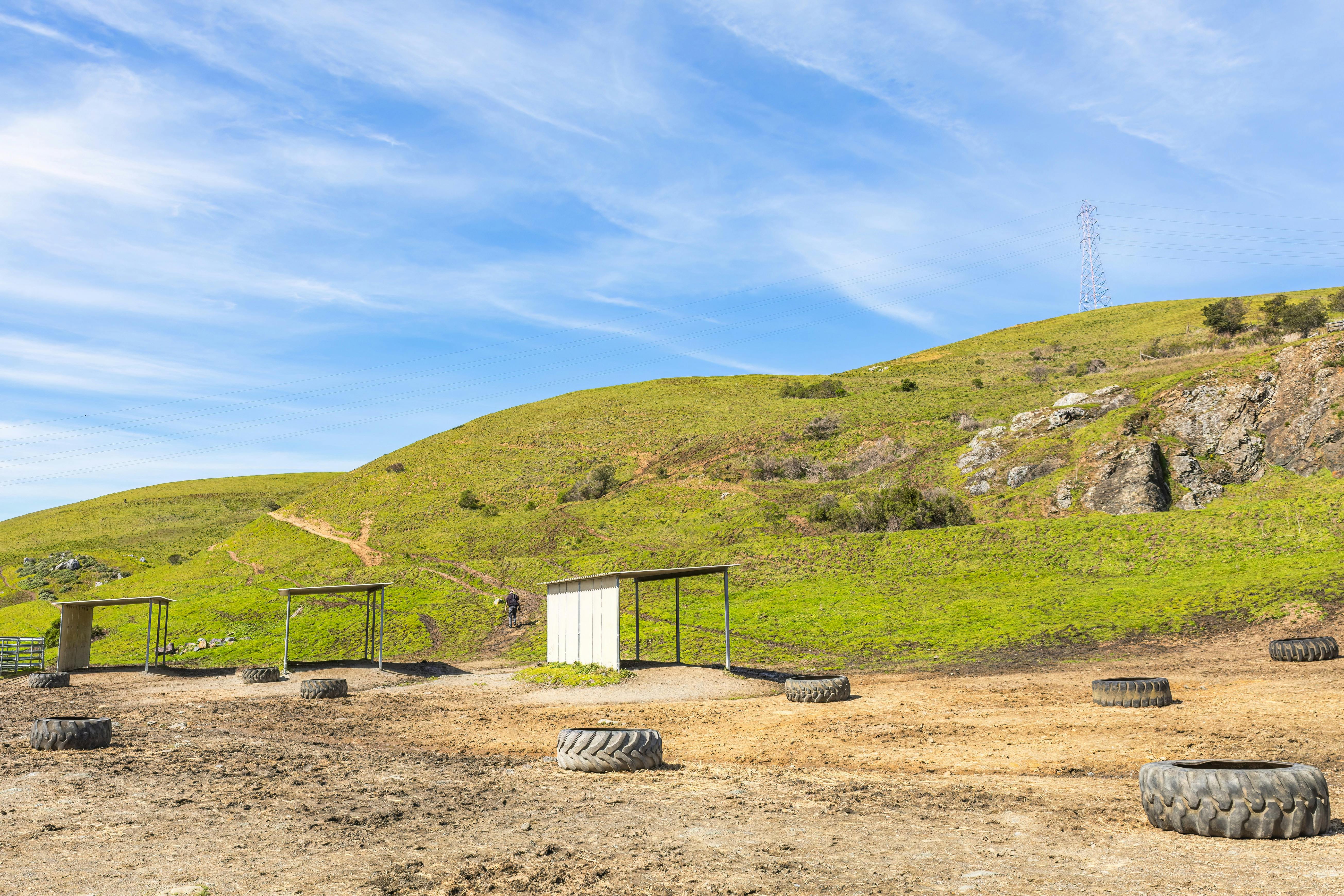 Car Tires Scattered on Field in Countryside · Free Stock Photo