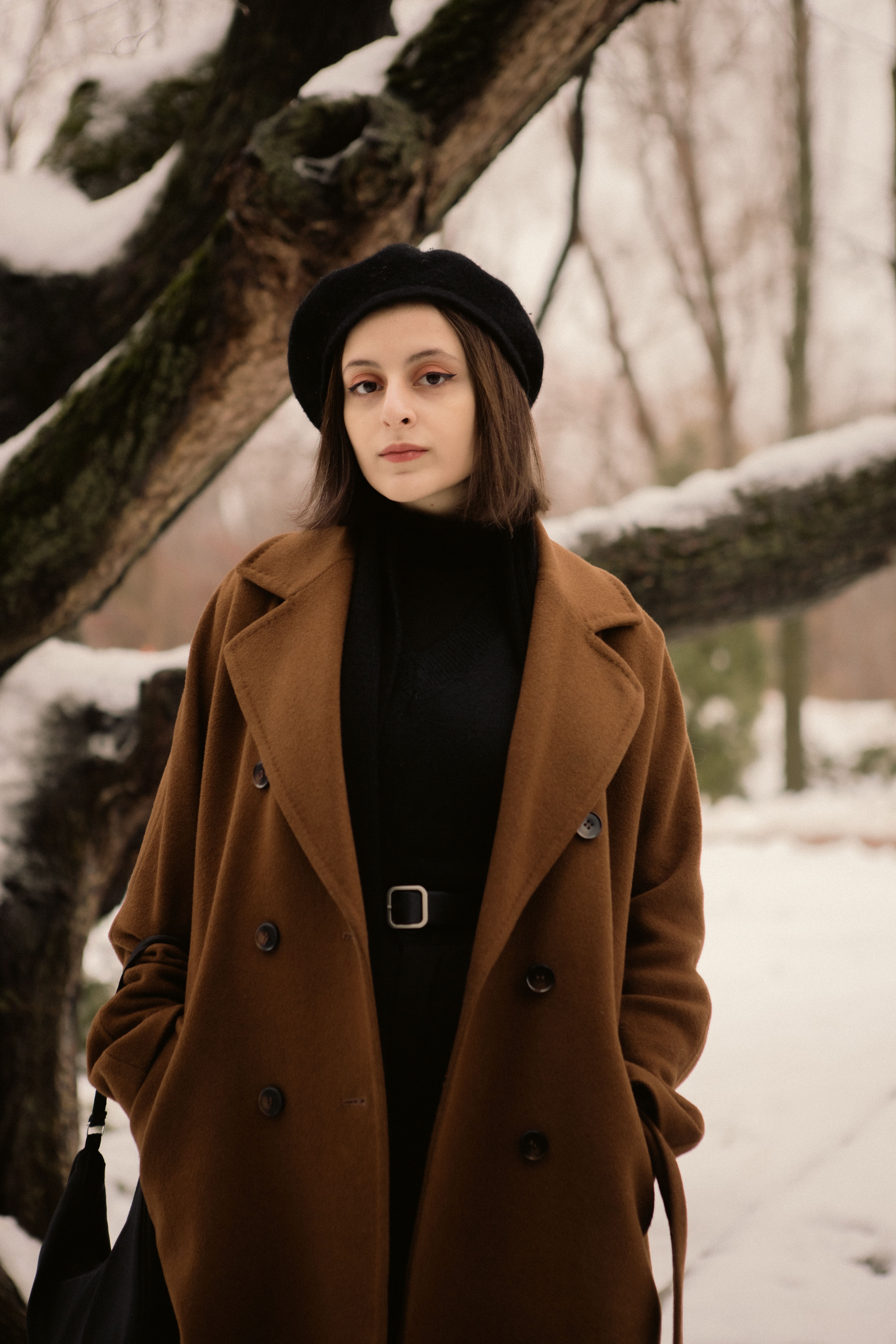 Woman Posing in Coat near Tree in Winter · Free Stock Photo