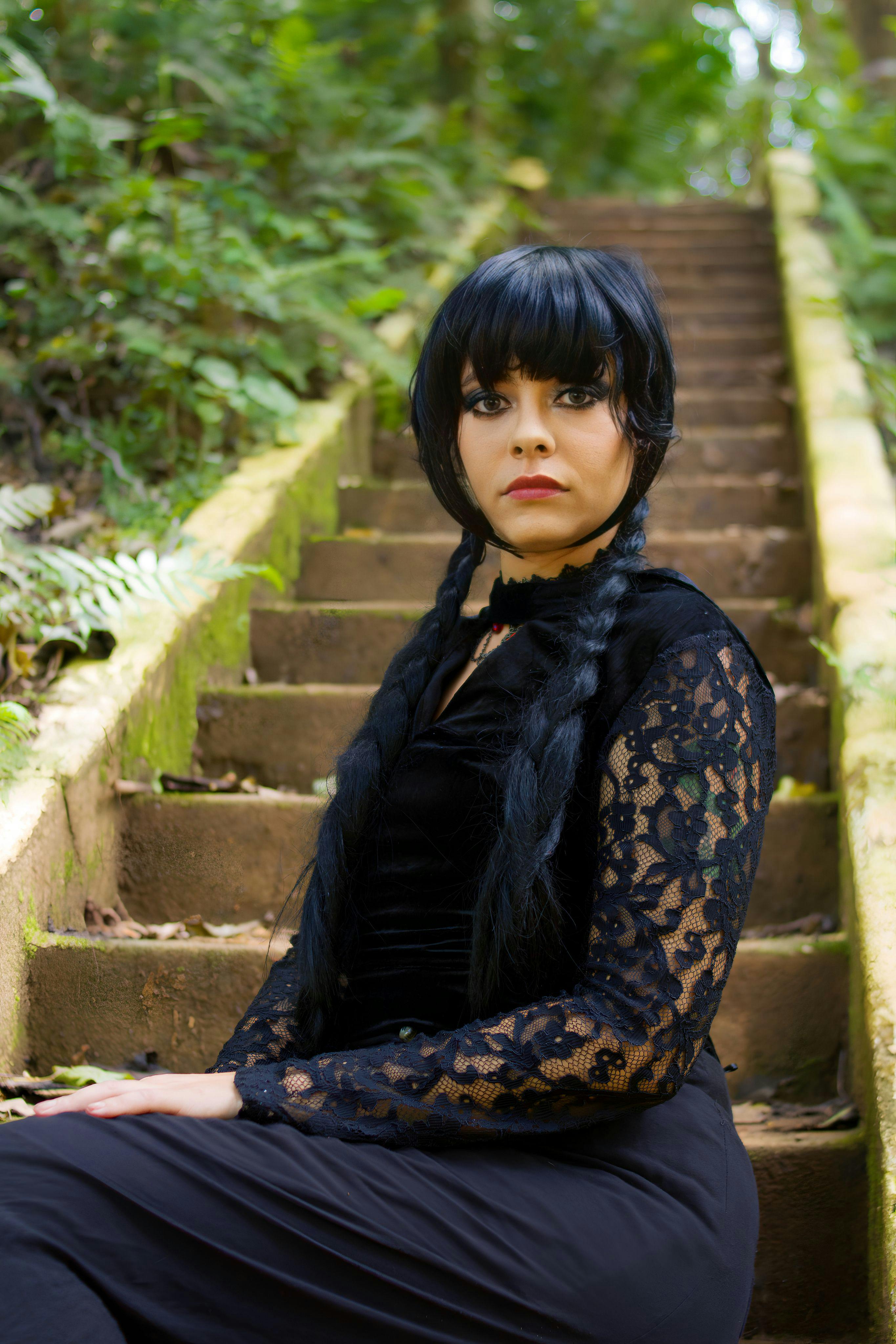 Woman Wearing Dark Clothes Sitting on Stairs in a Park · Free Stock Photo