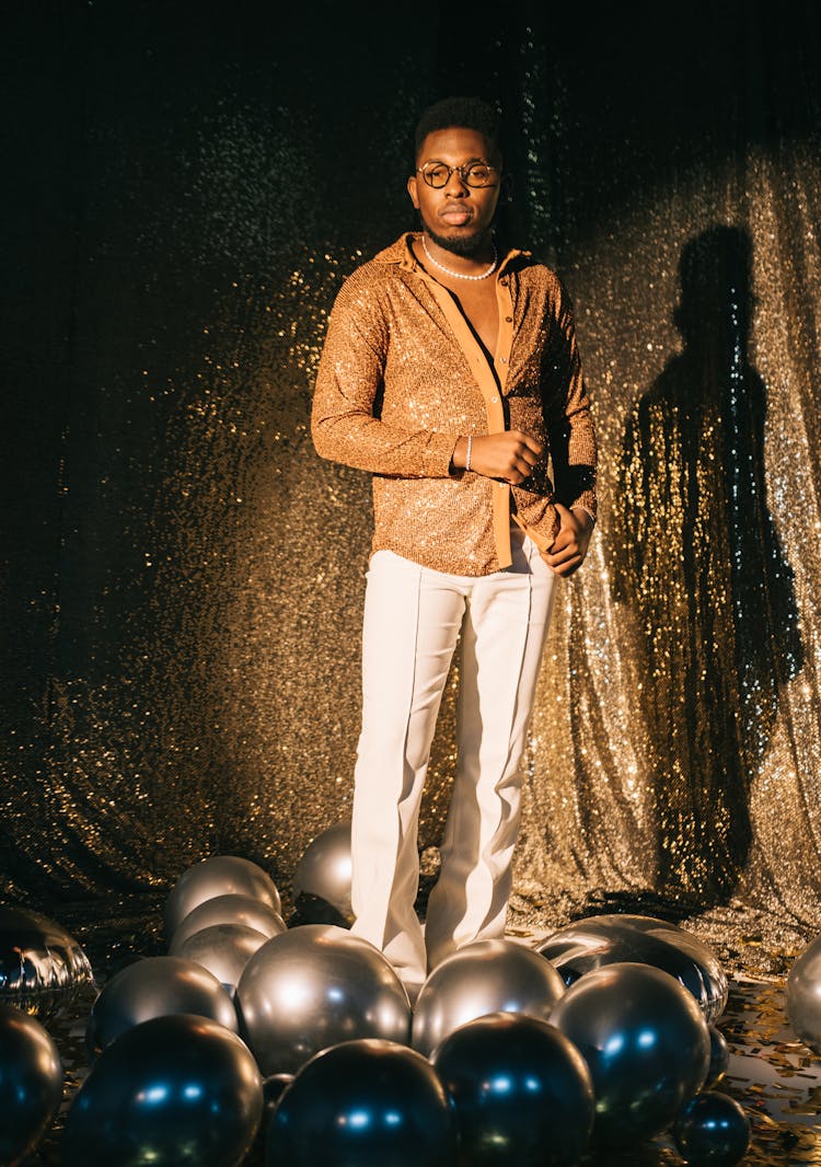 Man Standing Between Balloons