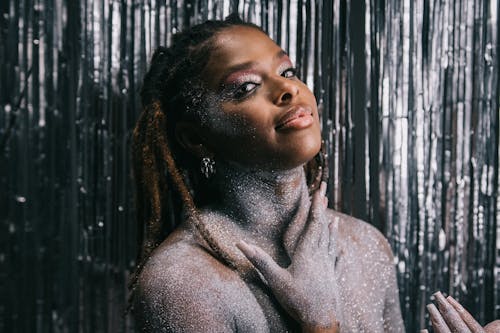 Young Woman with Her Body Covered in Glitter 