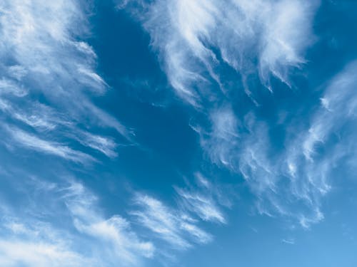 Cirrus Clouds against Blue Sky 