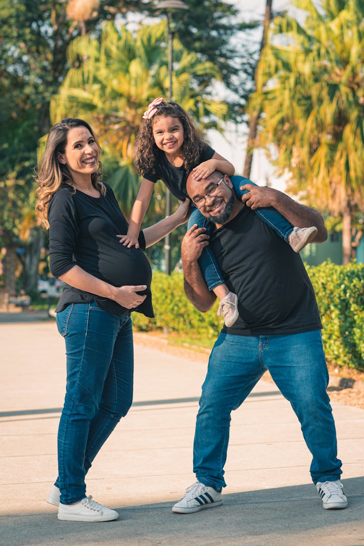 Smiling Family In A Park