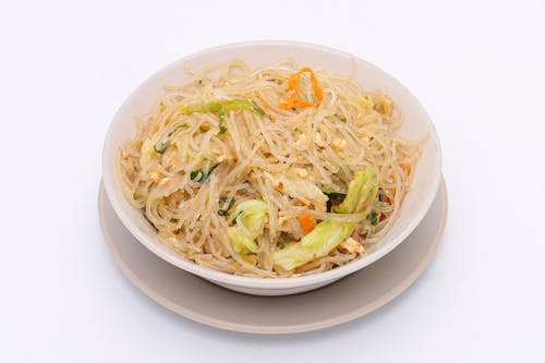 Thai street food, Stir-fried vermicelli with egg and vegetables on a white background