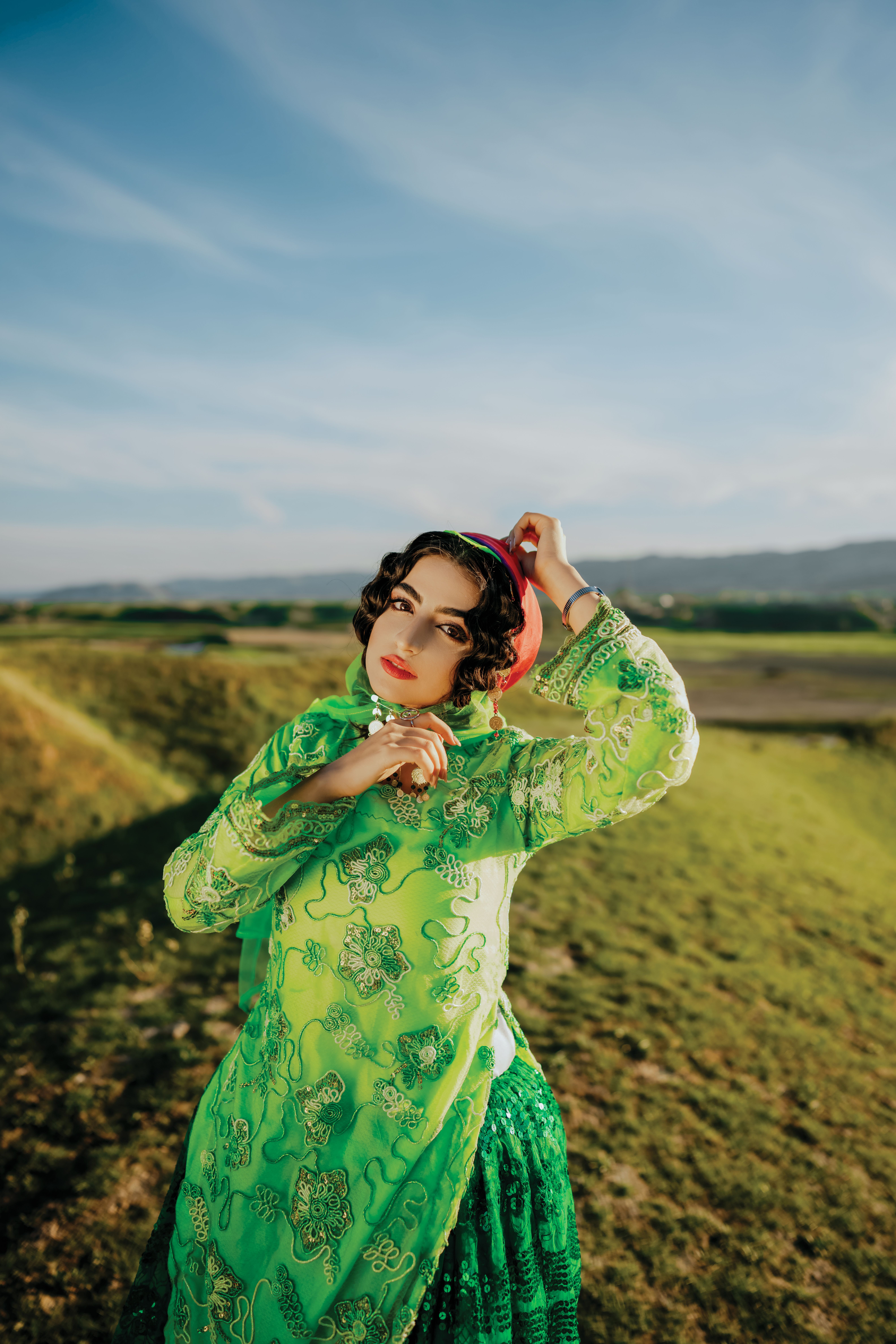 Woman in Green Dress Standing on the Field · Free Stock Photo