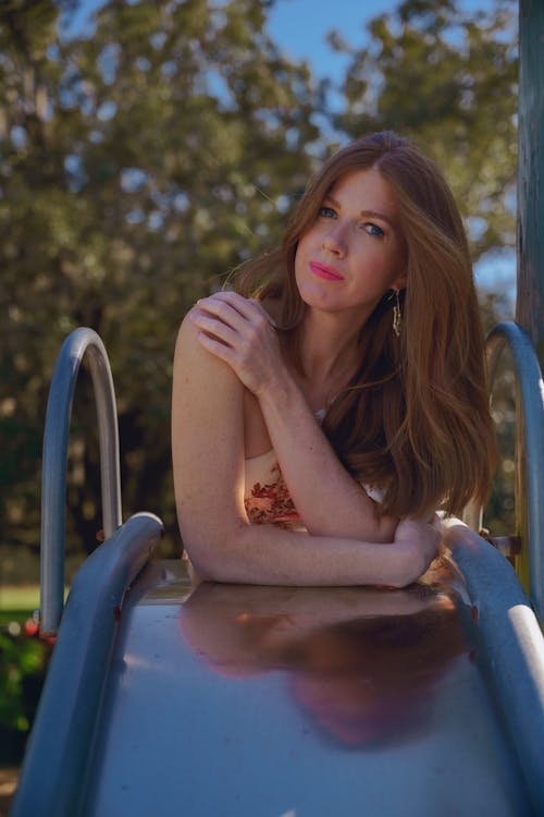 Woman Leaning Against the Slides