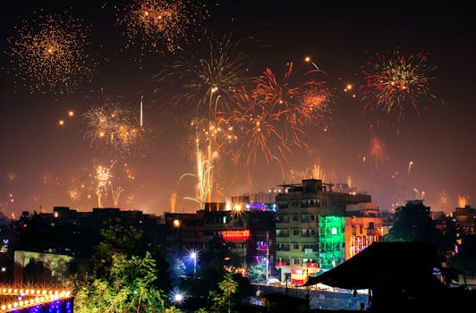Vibrant fireworks light up the night sky during a festival in an Indian city.