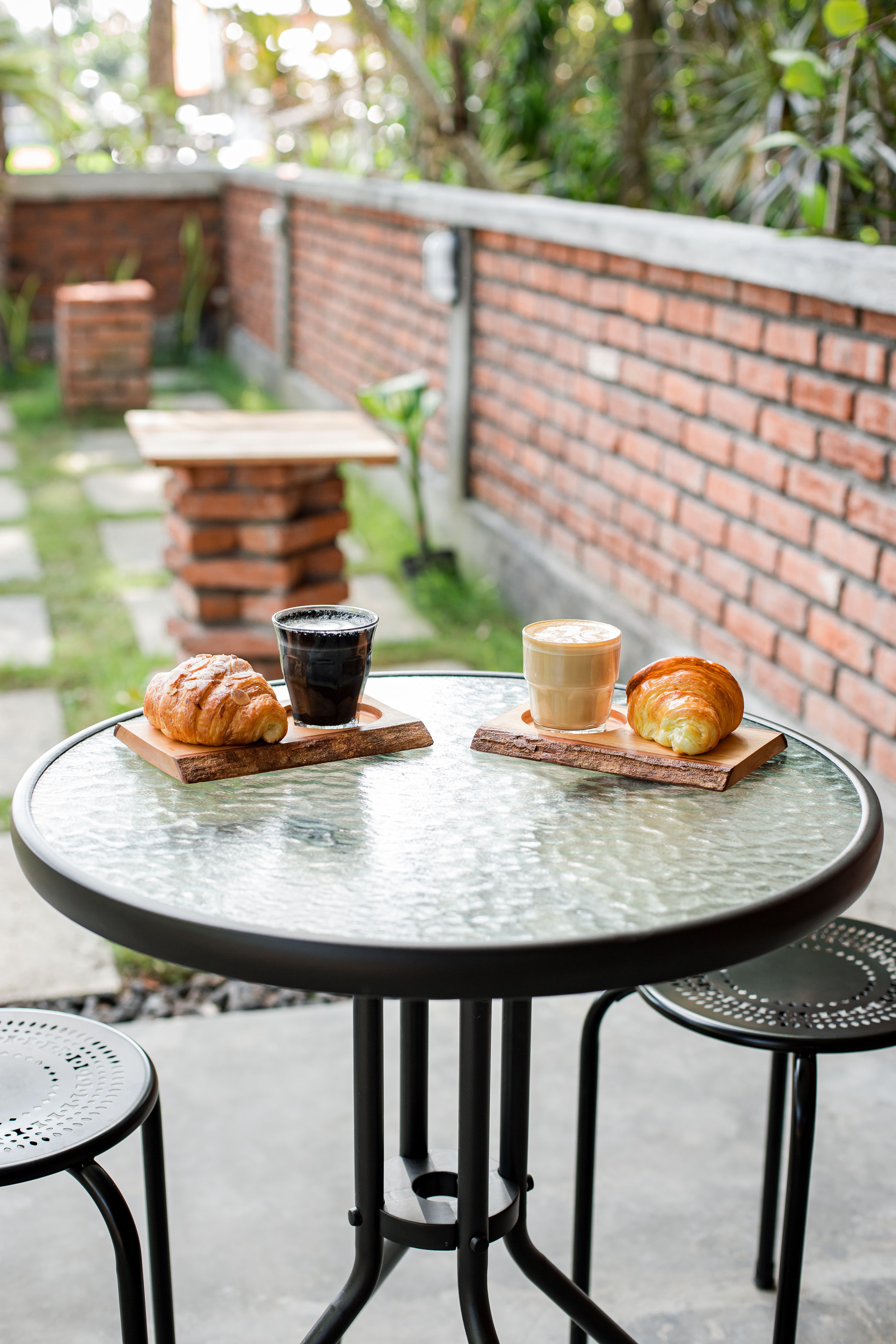 Coffee on a Table in a Cafe and a Tote Bag on a Chair · Free Stock Photo