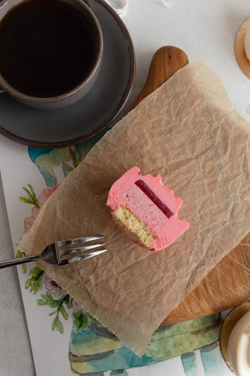 A Slice of Cake with Pink Cream 