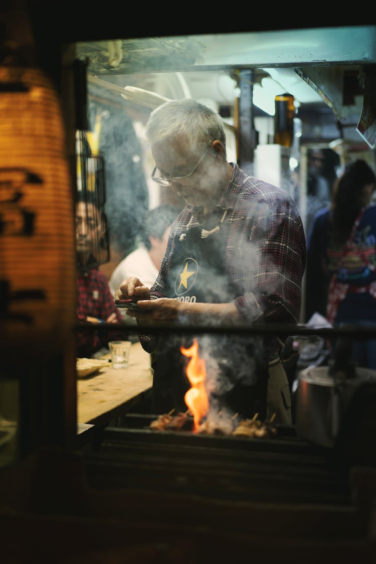 Candid Shot Of A Chef Standing In A Street Food Restaurant 