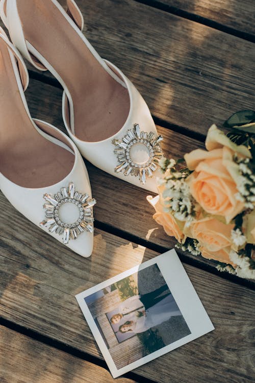 Close up of Wedding Shoes, Flowers and Picture