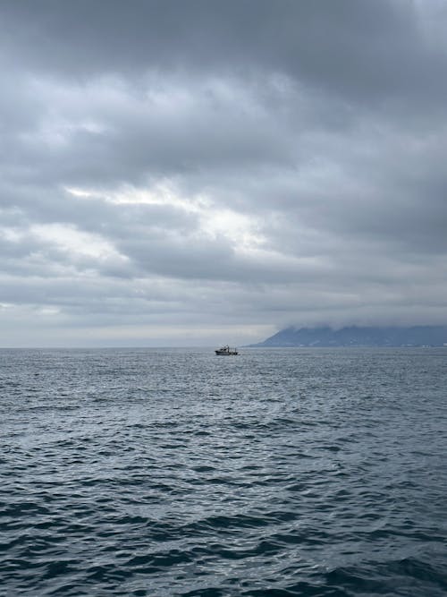 Boat at the Sea under an Overcast Sea