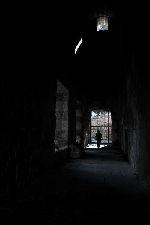 Free Silhouette of a person walking in a dark corridor in Antalya, Türkiye. Stock Photo