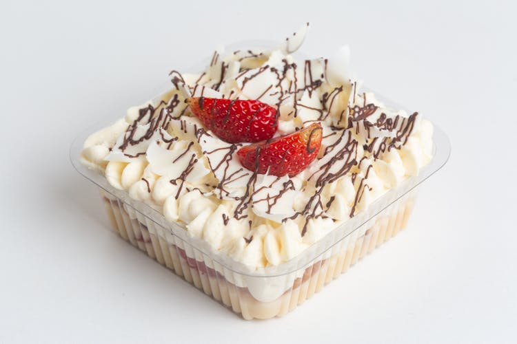 A Cake With Cream And Strawberries 