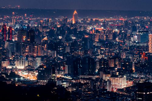 Free Vibrant cityscape with illuminated skyscrapers against the night sky. Stock Photo