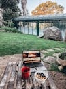 Turned-on Macbook Pro on Brown Table