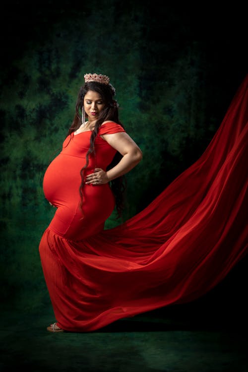 Pregnant Woman in Long Red Dress
