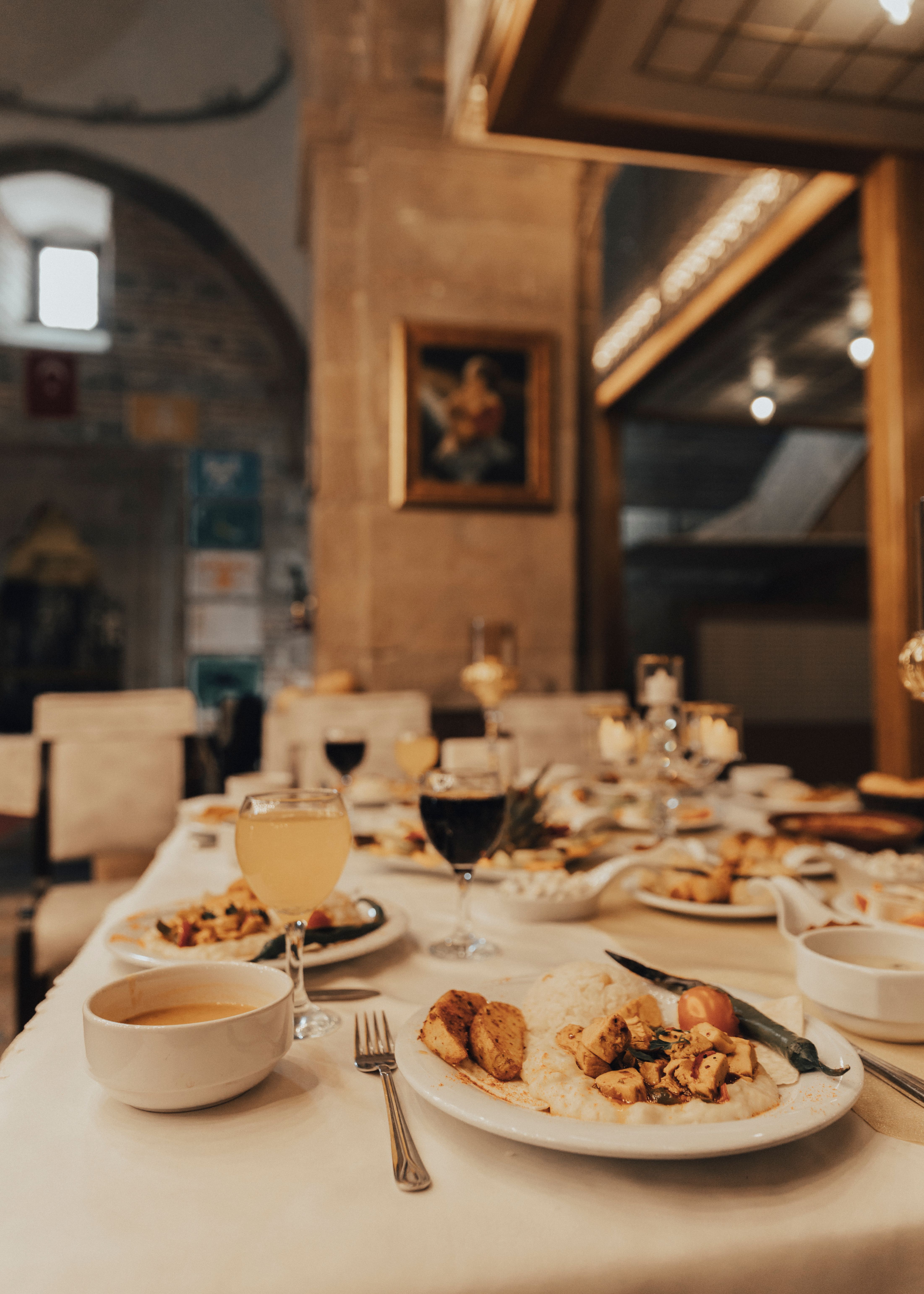 A beautifully arranged Turkish meal in a historic setting, capturing a warm and inviting atmosphere.
