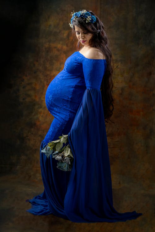 A Young Pregnant Woman in Blue Gown