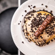 Pancakes topped with cream and chocolate — photo by Cyprus Eats on Pexels