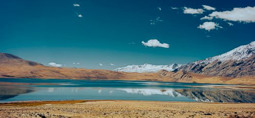 Free Breathtaking view of snowcapped mountains and serene lake reflection in Ladakheda, India. Stock Photo