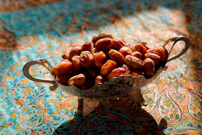 Bowl of fresh dates fruit showing their rich caramel color