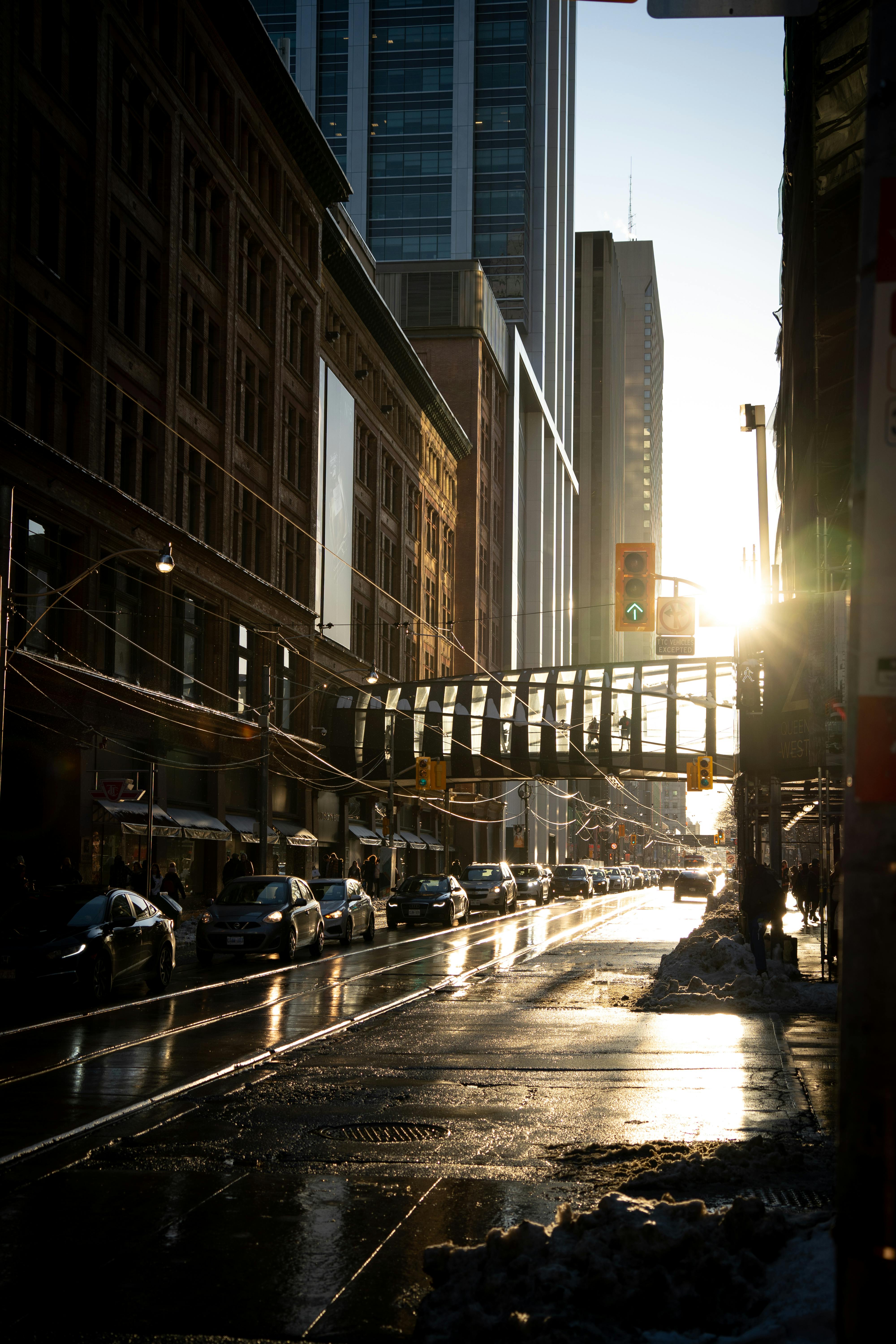Beautiful urban cityscape of Toronto at dusk with cars and skyscrapers.