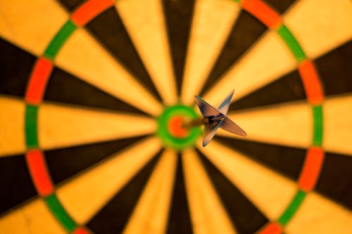 Free Black Dart Hit a Bullseye Stock Photo