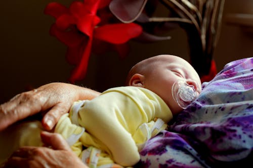 Free Toddler Sleeping While Sucking Pacifier Stock Photo