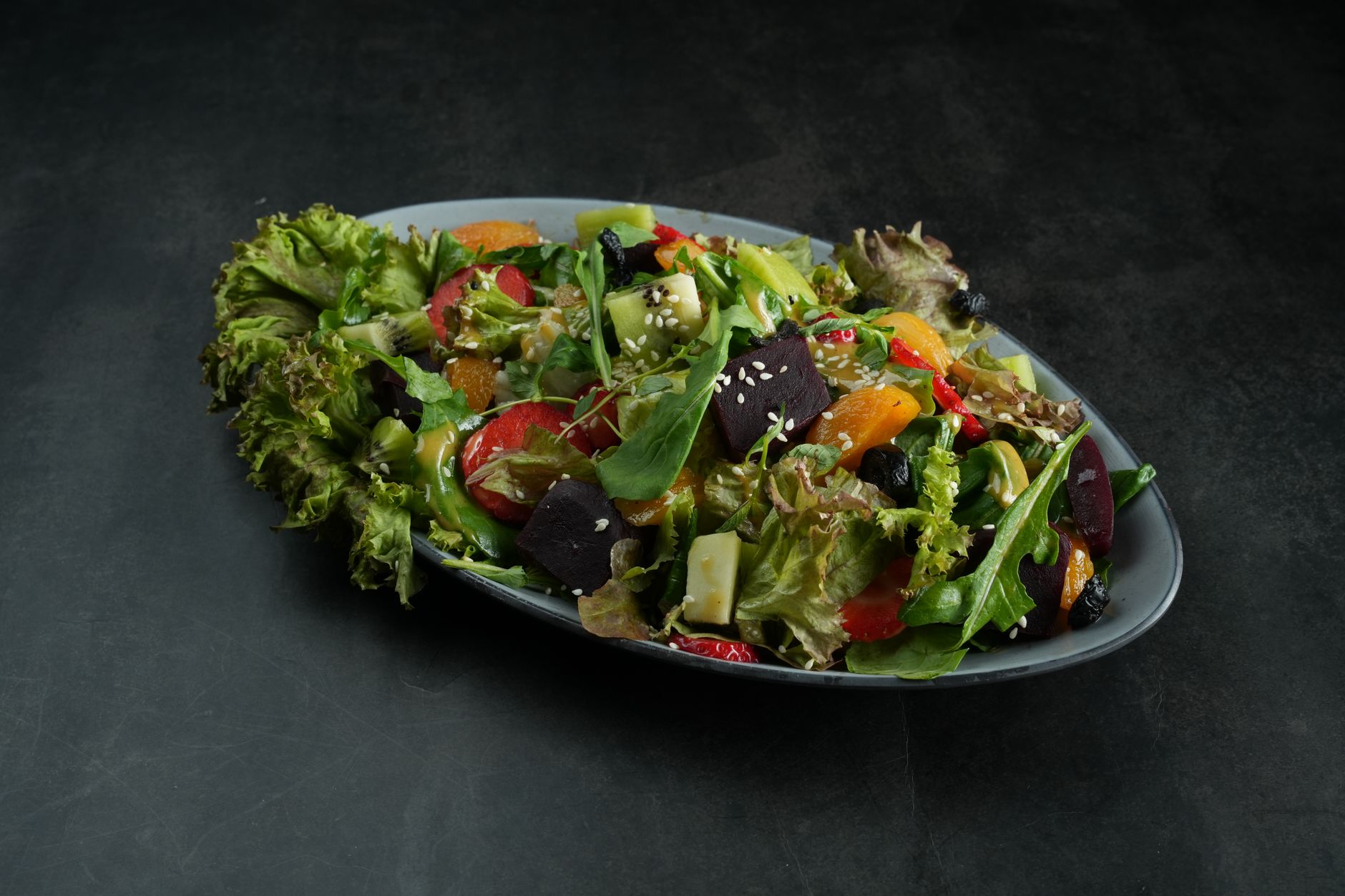 Mixed greens salad with vibrant passion fruit dressing