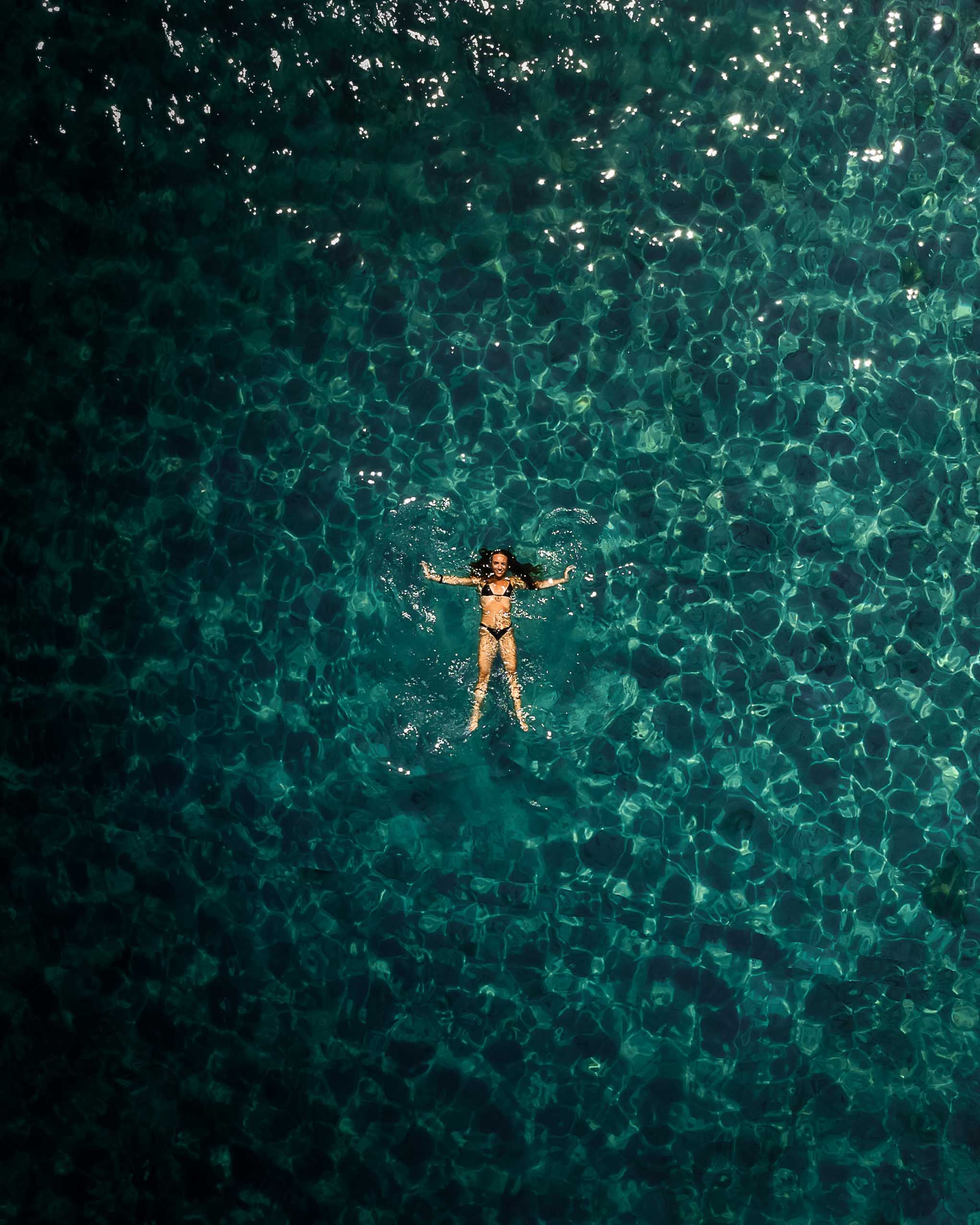 Top View Photo of Woman Floating on Water · Free Stock Photo