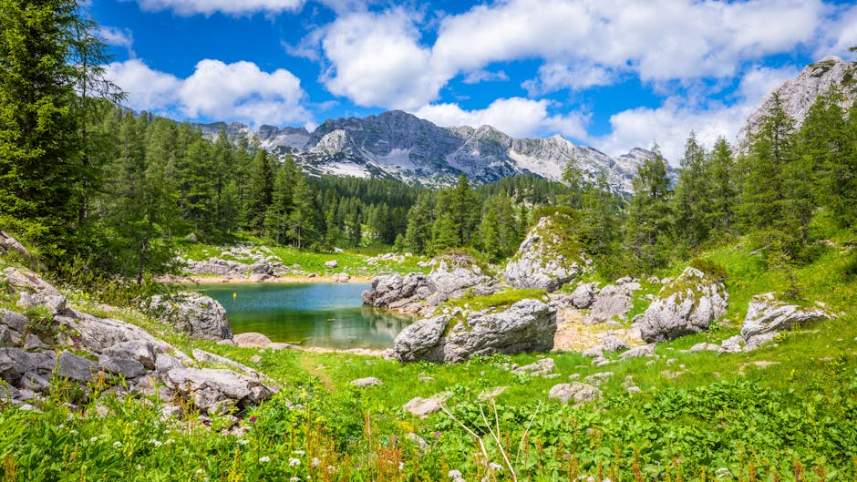 Lake Bohinj with the Julian Alps in the background - Hidden gems Europe Lake Bohinj with the Julian Alps in the background - Hidden gems Europe