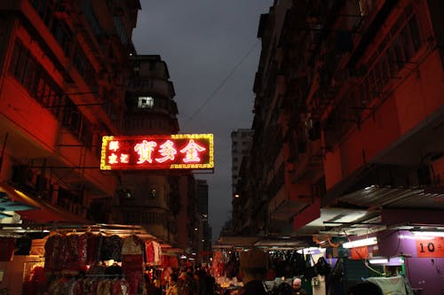 View of an Illuminated Night Market in City 