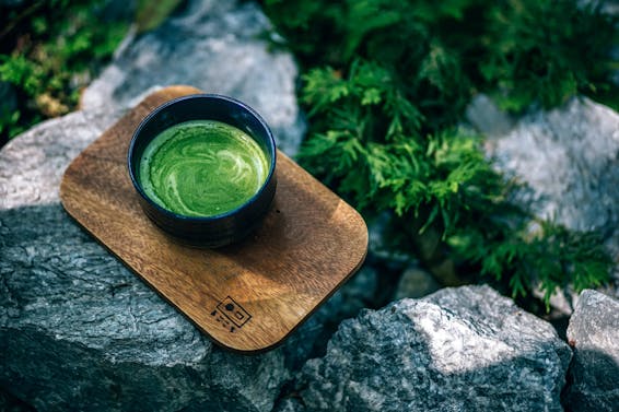 Photo of Matcha Drink on a Wooden Tray