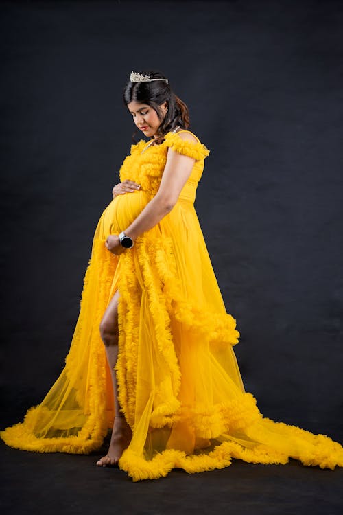 Woman Posing in Yellow Dress