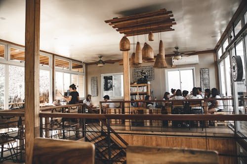 Free People Inside Room and Surrounding Table Stock Photo