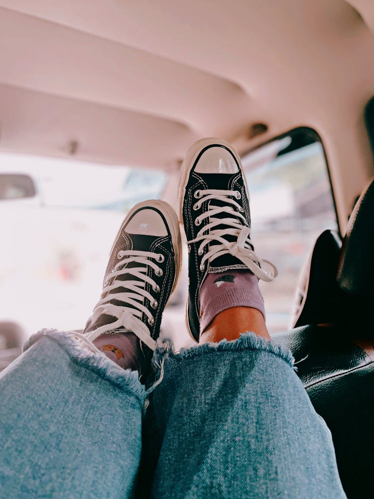 Legs In Shiny New Black Converse 