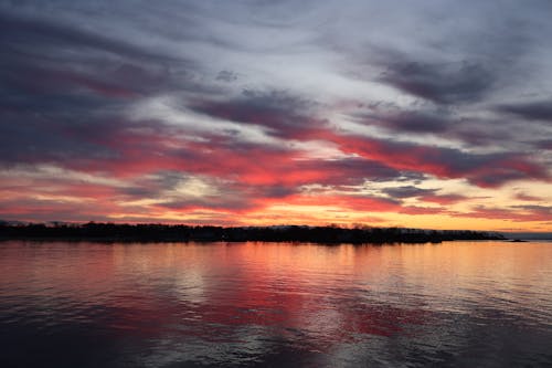 Dramatic Sunset Sky over a Body of Water 