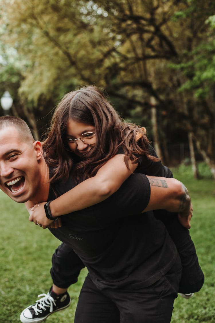 Smiling Man Carrying Girl